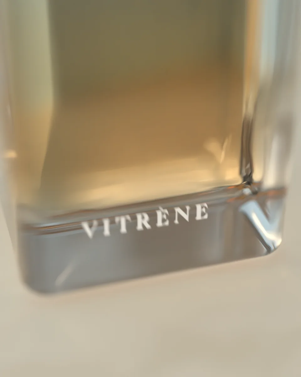 Macro of the bottle's solid glass base with VITRÈNE engraved inside it.